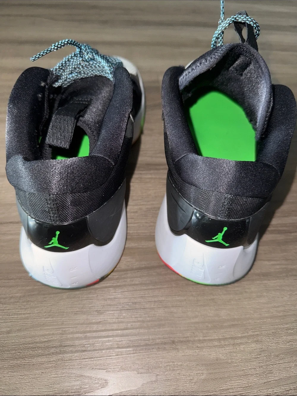 Jordan Black High-Top Sneaker with Green Jumpman and Multicolor Sole